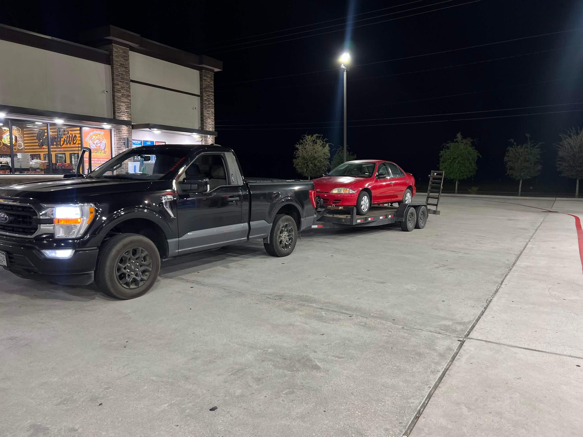H-Town Auto Buyers truck hauling a car it bought for cash in the Houston area